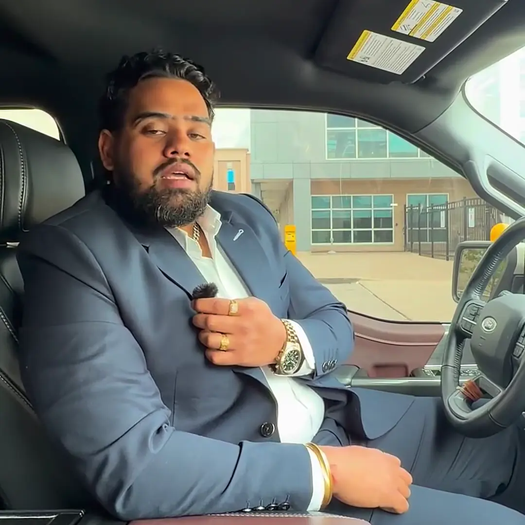 Nitin Sharma speaking from the driver's seat of a car